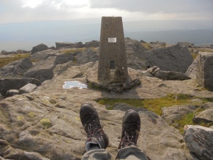 Boots with a view, Trig Point on the summit of Great Whernside